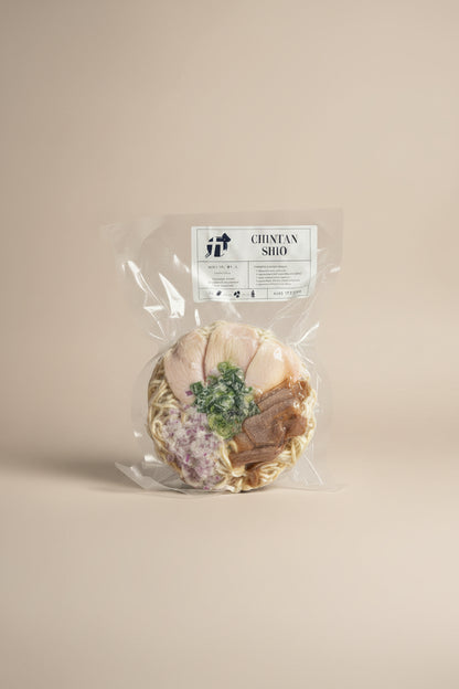 Packaged Frozen Chintan Shio Ramen with visible toppings such as chicken, red onion, bamboo shoot, and scallion.